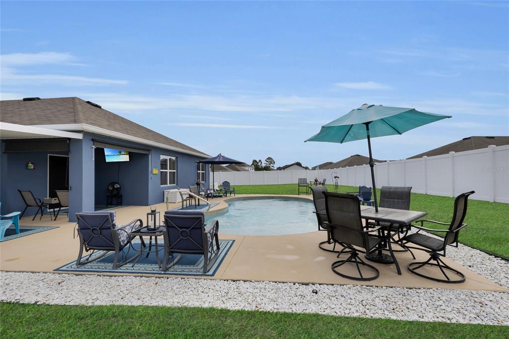 3016 Northeast 43rd Road Ocala, FL 34470 - Photo 28 of 35 a view of a house with sitting area and furniture