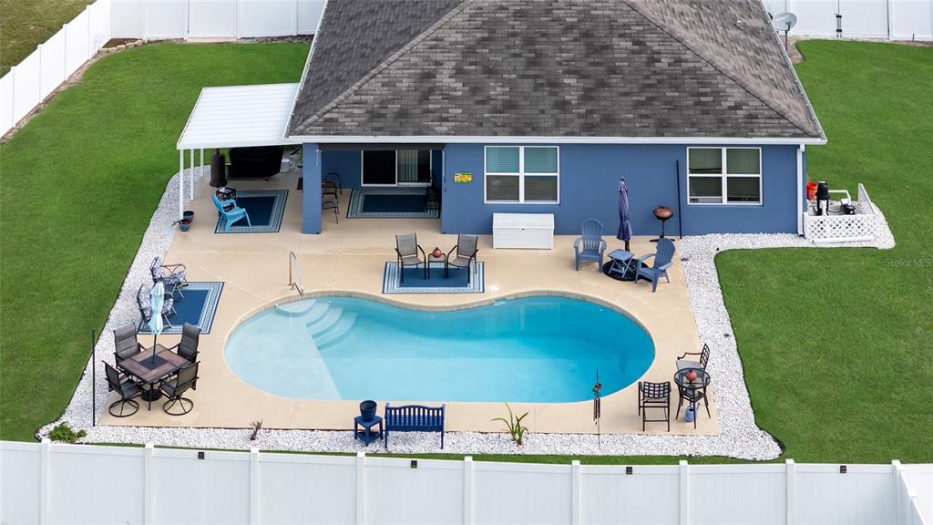 3016 Northeast 43rd Road Ocala, FL 34470 - Photo 3 of 35 an aerial view of a house with outdoor space patio and furniture
