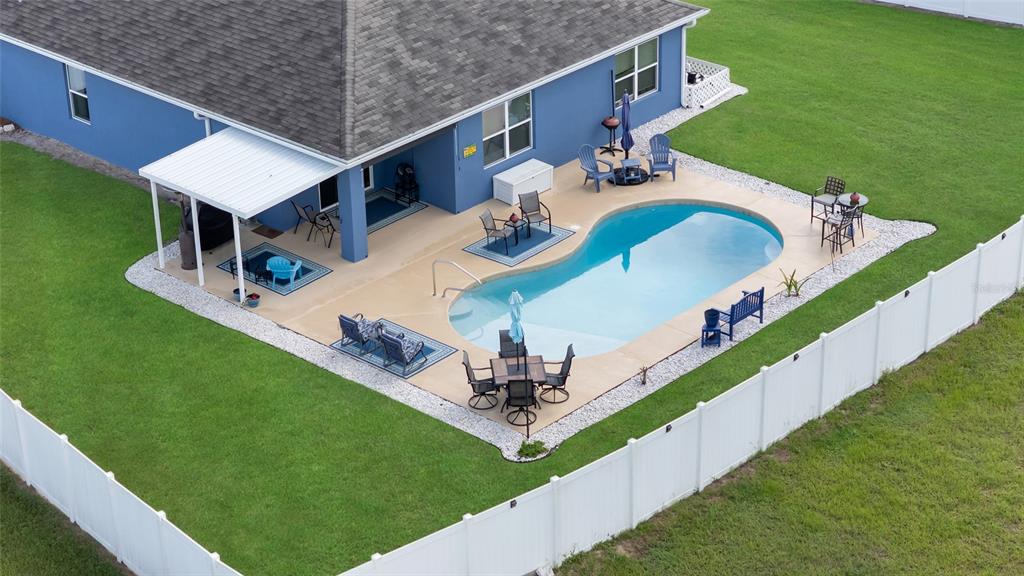 3016 Northeast 43rd Road Ocala, FL 34470 - Photo 4 of 35 a view of a house with a backyard