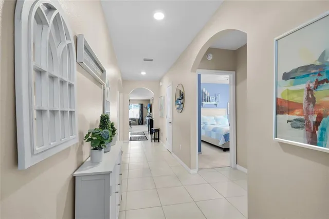 a kitchen with refrigerator and cabinets
