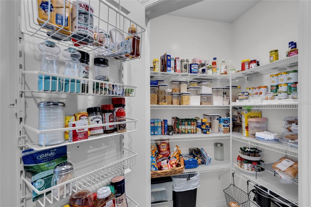 3016 Northeast 43rd Road Ocala, FL 34470 - Photo 9 of 35 a utility room with lots of clutter and cabinets