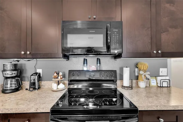 a living room with kitchen furniture