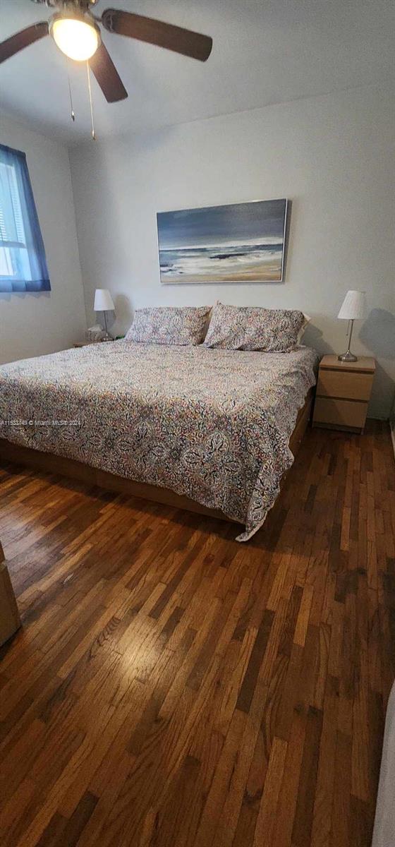 60 Northwest 79th Street, Unit 28 Miami, FL 33150 - Photo 16 of 28 a bedroom with a bed and lamp