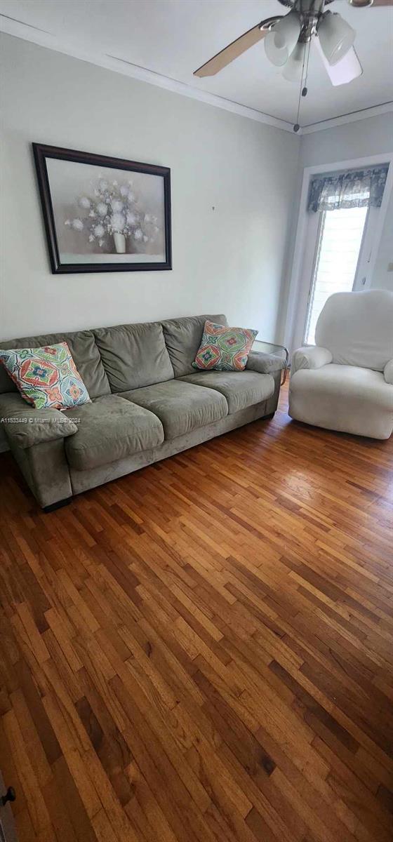 60 Northwest 79th Street, Unit 28 Miami, FL 33150 - Photo 17 of 28 a living room with furniture and a painting