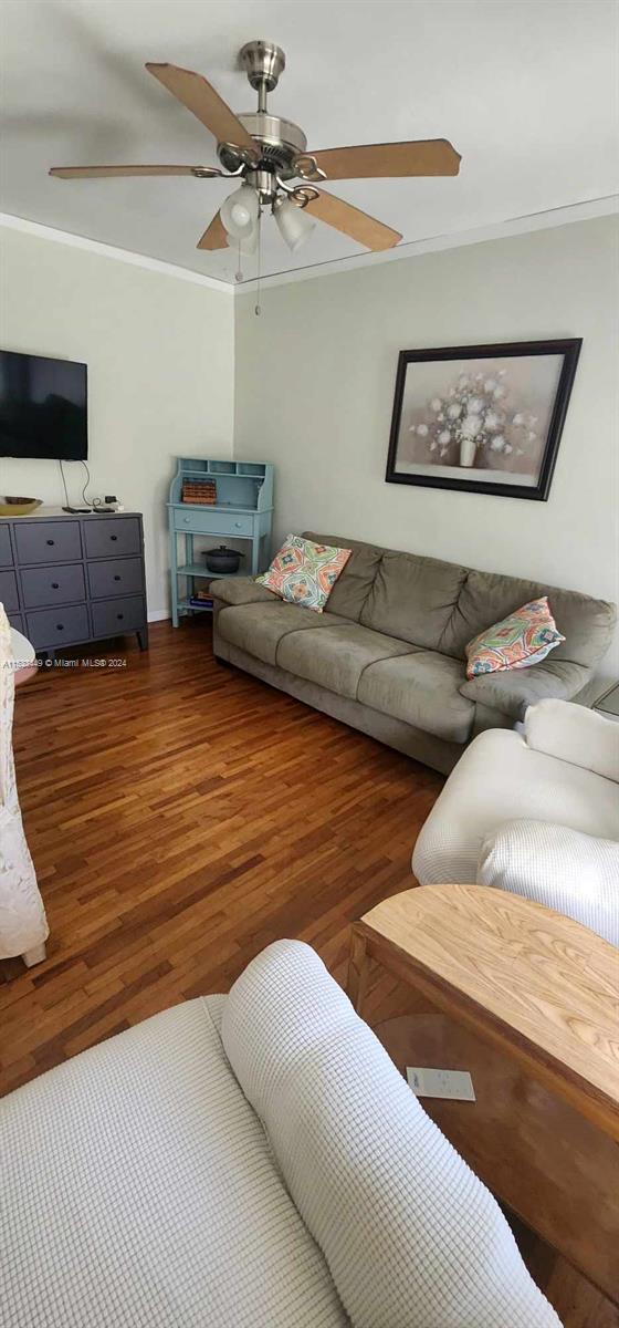 60 Northwest 79th Street, Unit 28 Miami, FL 33150 - Photo 23 of 28 a living room with furniture and a flat screen tv
