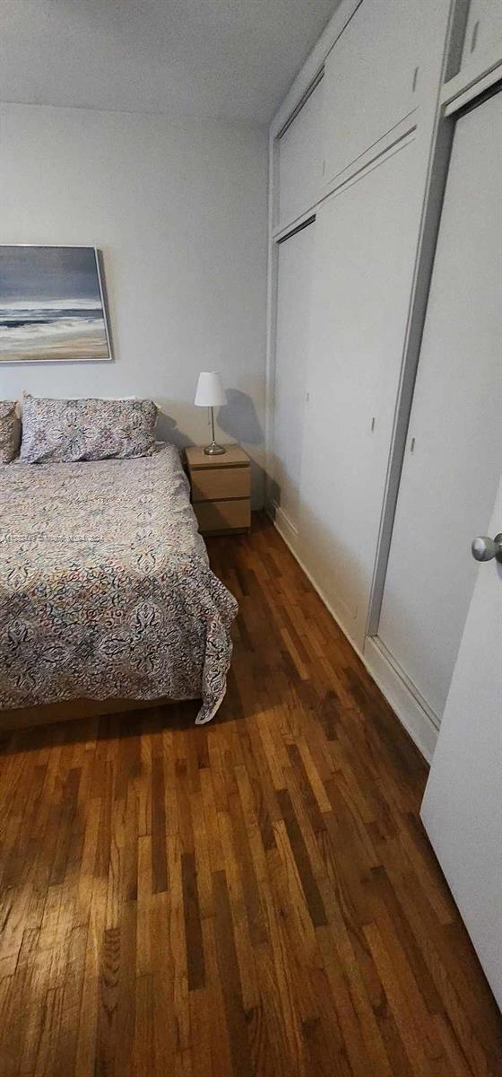 60 Northwest 79th Street, Unit 28 Miami, FL 33150 - Photo 26 of 28 a bedroom with a bed and a window