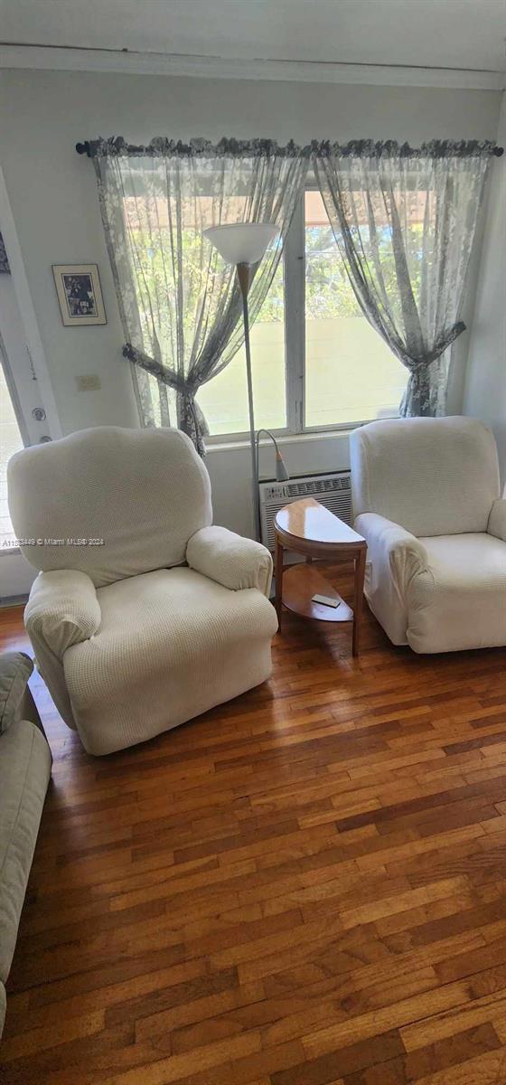 60 Northwest 79th Street, Unit 28 Miami, FL 33150 - Photo 3 of 28 a living room with furniture and a large window