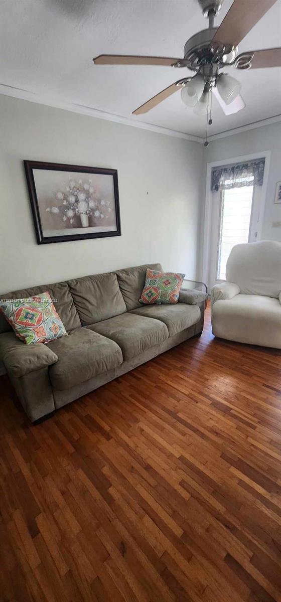 60 Northwest 79th Street, Unit 28 Miami, FL 33150 - Photo 4 of 28 a living room with furniture and a wooden floor