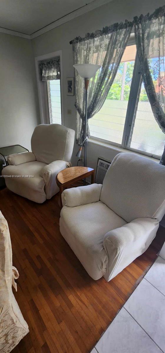 60 Northwest 79th Street, Unit 28 Miami, FL 33150 - Photo 6 of 28 a living room with furniture and a window