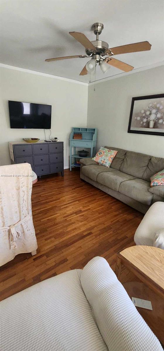 60 Northwest 79th Street, Unit 28 Miami, FL 33150 - Photo 7 of 28 a living room with furniture and a flat screen tv