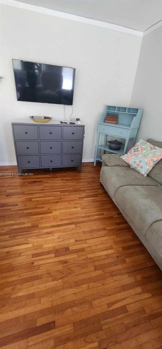 60 Northwest 79th Street, Unit 28 Miami, FL 33150 - Photo 9 of 28 a living room with furniture and a flat screen tv