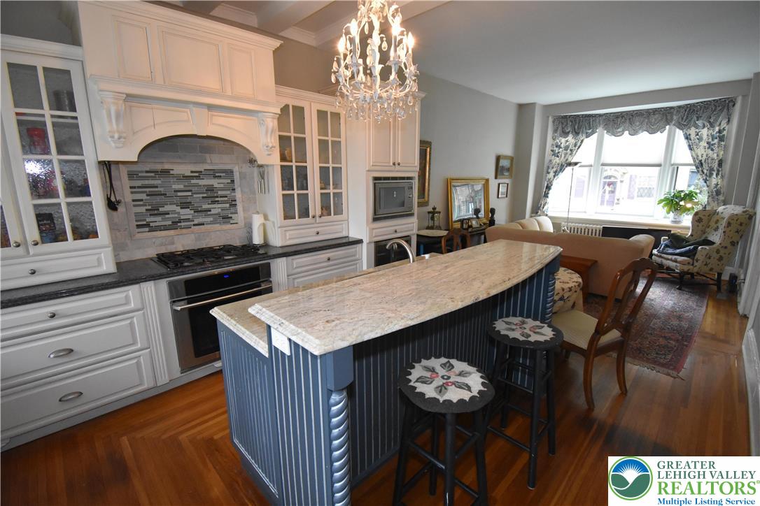 134 North 3rd Street Easton, PA 18042 - Photo 14 of 38 a view of a kitchen area with furniture window and wooden floor