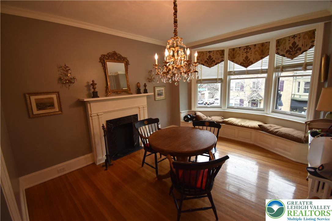 134 North 3rd Street Easton, PA 18042 - Photo 22 of 38 a dining room with furniture a chandelier and wooden floor