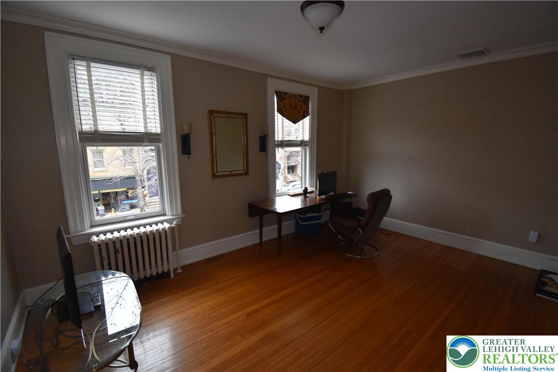 134 North 3rd Street Easton, PA 18042 - Photo 23 of 38 a workspace with wooden floor and a window