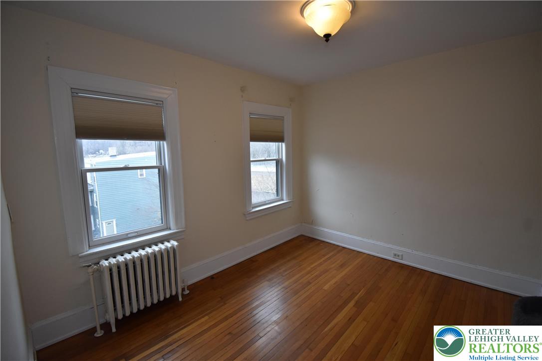 134 North 3rd Street Easton, PA 18042 - Photo 31 of 38 a view of an empty room with wooden floor and a window