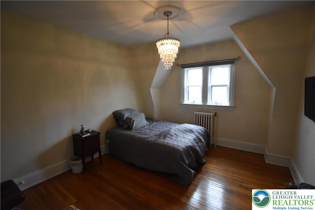 134 North 3rd Street Easton, PA 18042 - Photo 32 of 38 a bedroom with bed and window