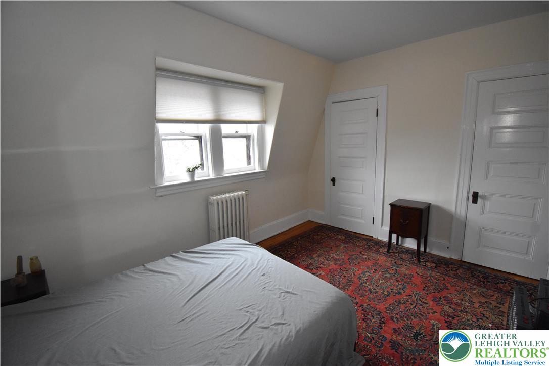 134 North 3rd Street Easton, PA 18042 - Photo 33 of 38 a bedroom with a bed and a chair