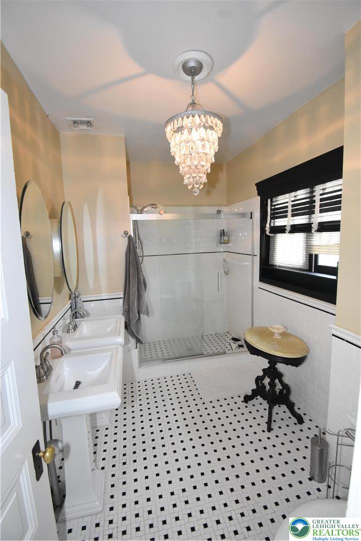134 North 3rd Street Easton, PA 18042 - Photo 34 of 38 a bathroom with a sink a toilet and a mirror