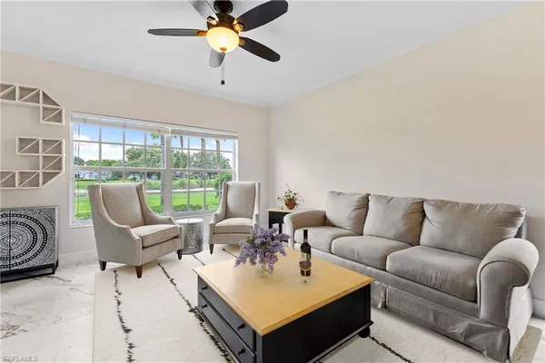 a living room with furniture and a window