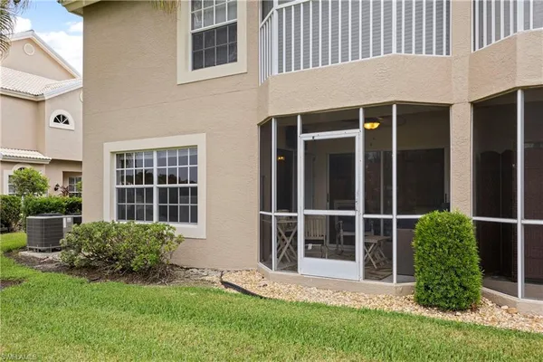 a view of front door and potted plants
