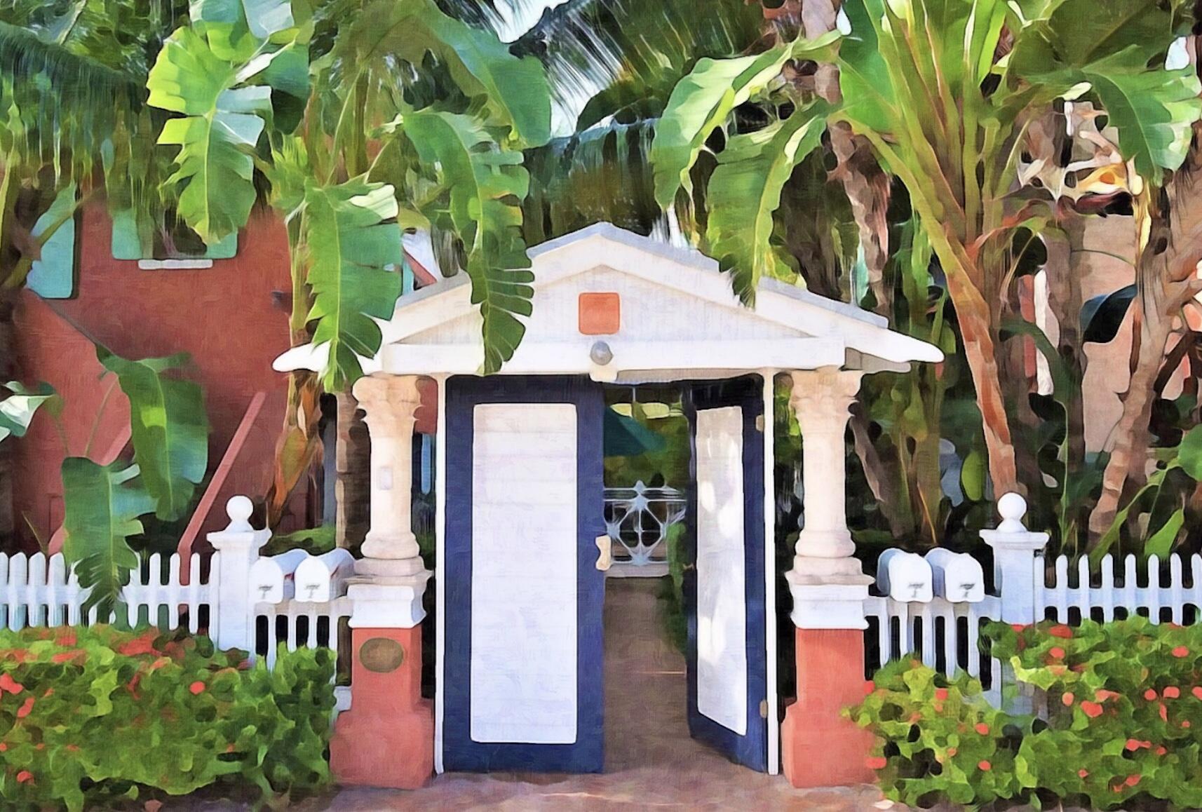 102 Southeast 7th Avenue, Unit VILLA 1 Delray Beach, FL 33483 - Photo 1 of 27 a front view of a house with a yard