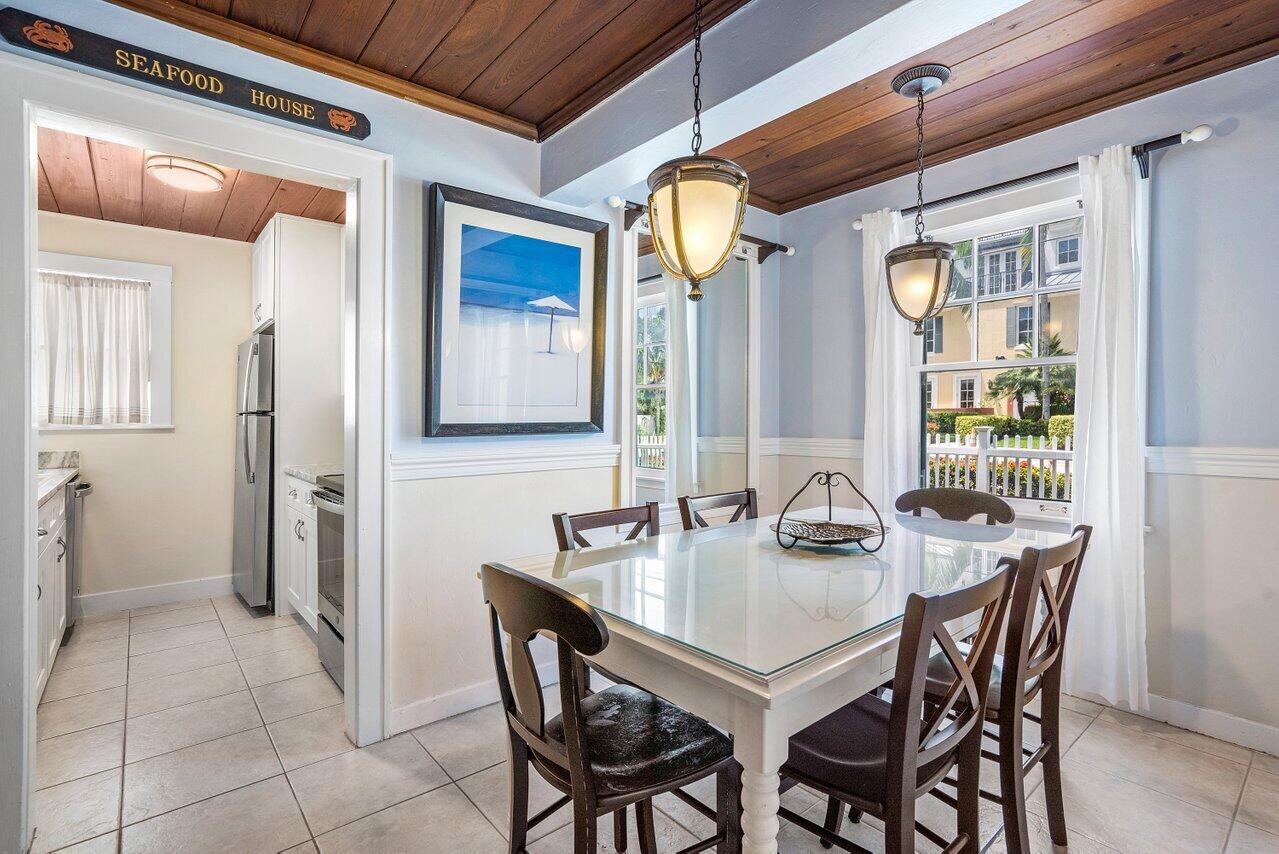102 Southeast 7th Avenue, Unit VILLA 1 Delray Beach, FL 33483 - Photo 11 of 27 a dining room with furniture and window