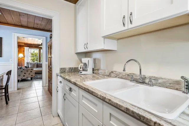 a kitchen with a sink and cabinets