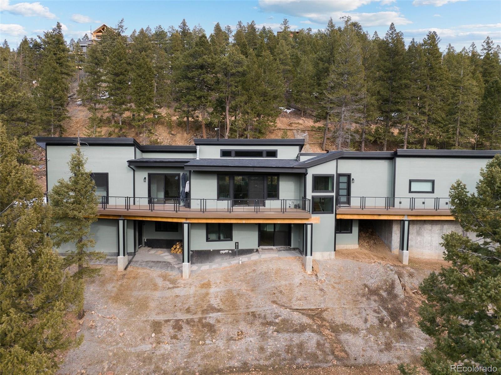 aerial view of house with outdoor space and garden