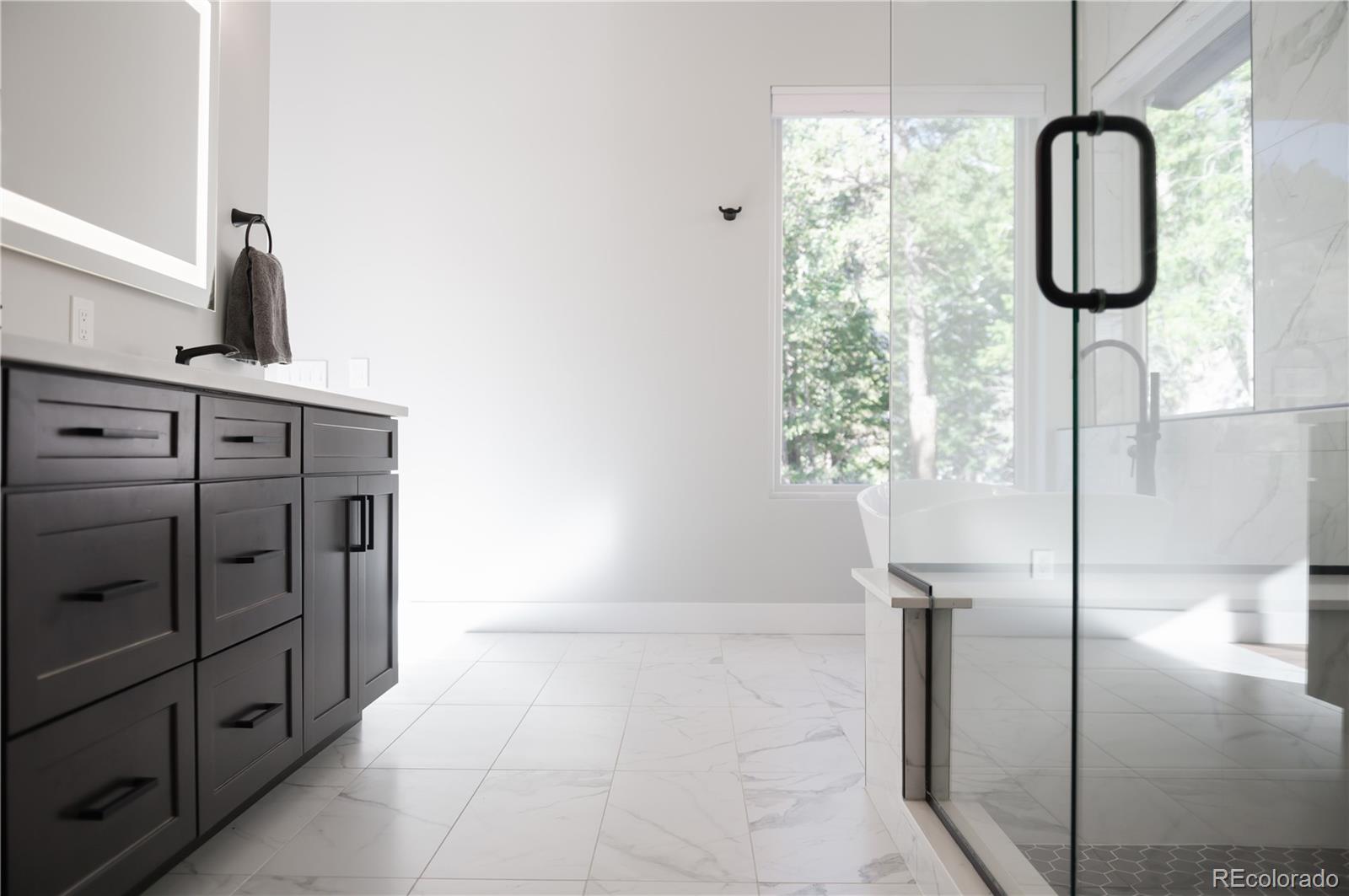 7231 Timber Trail Road Evergreen, CO 80439 - Photo 15 of 34 a bathroom with a shower