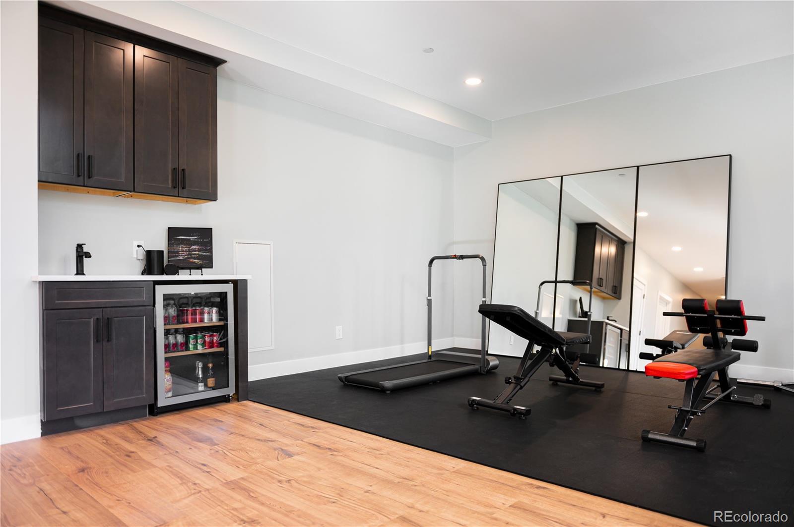 7231 Timber Trail Road Evergreen, CO 80439 - Photo 18 of 34 a living room with hard wood floors and a wooden floors