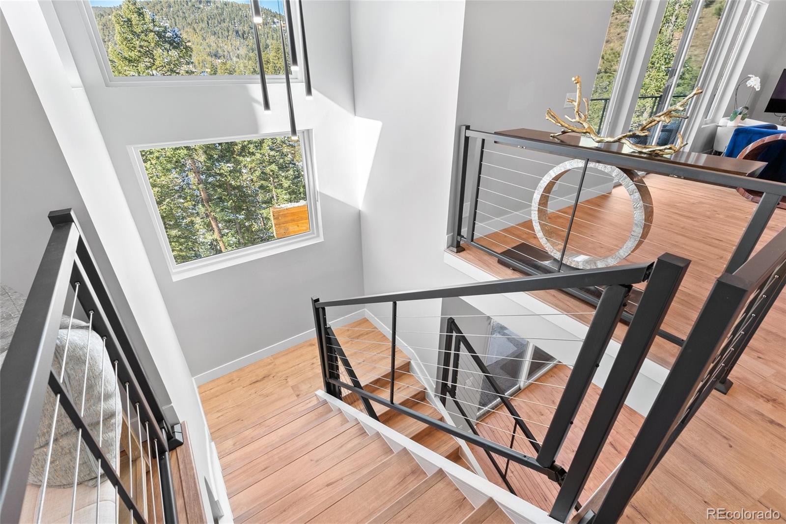 7231 Timber Trail Road Evergreen, CO 80439 - Photo 7 of 34 a view of an entryway with wooden floor