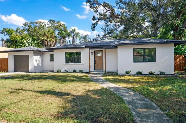 front view of a house with a yard
