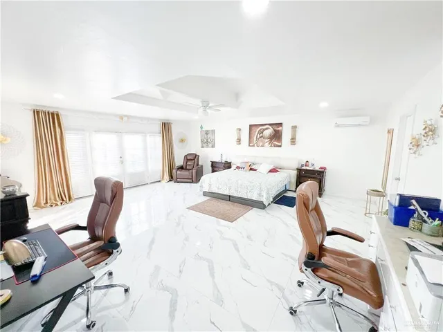 a bed room with a bed and a chair