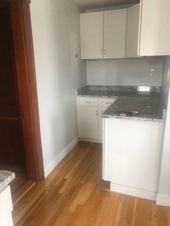 540 Nantasket Avenue, Unit 2 Hull, MA 02045 - Photo 4 of 10 a kitchen with a sink and a stove top oven