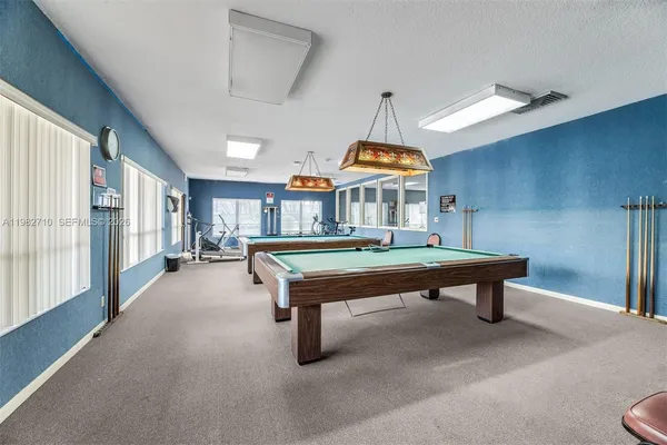 a view of swimming pool with a yard