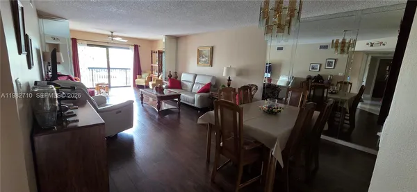 a bedroom with two beds and painting on the wall