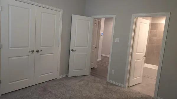 a bathroom with a sink mirror and vanity