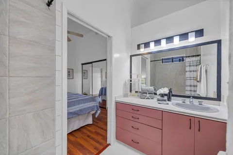 a bathroom with a sink double vanity and a mirror