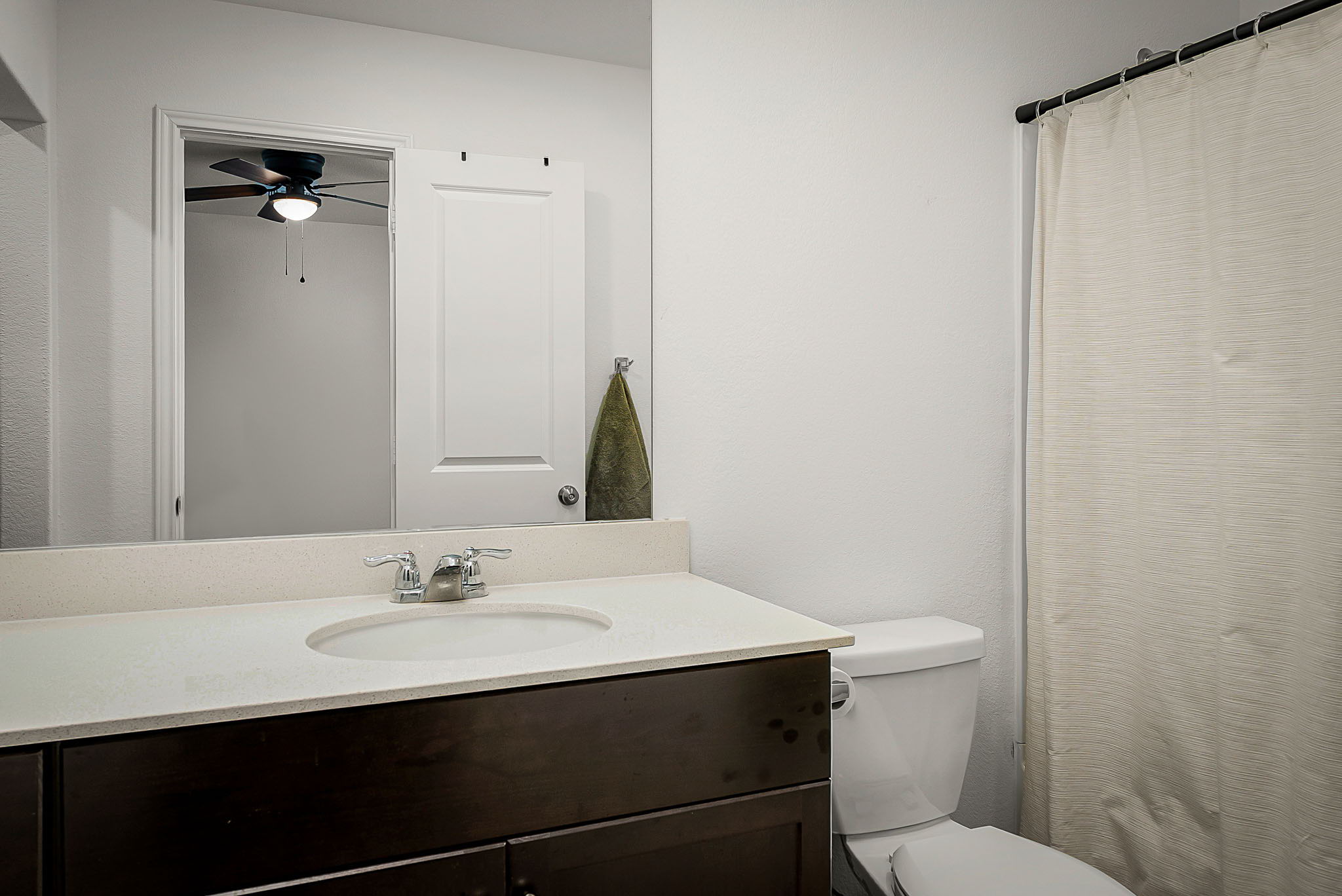 175 Amber Glen Maxwell, TX 78656 - Photo 25 of 27 a bathroom with a sink mirror vanity and toilet