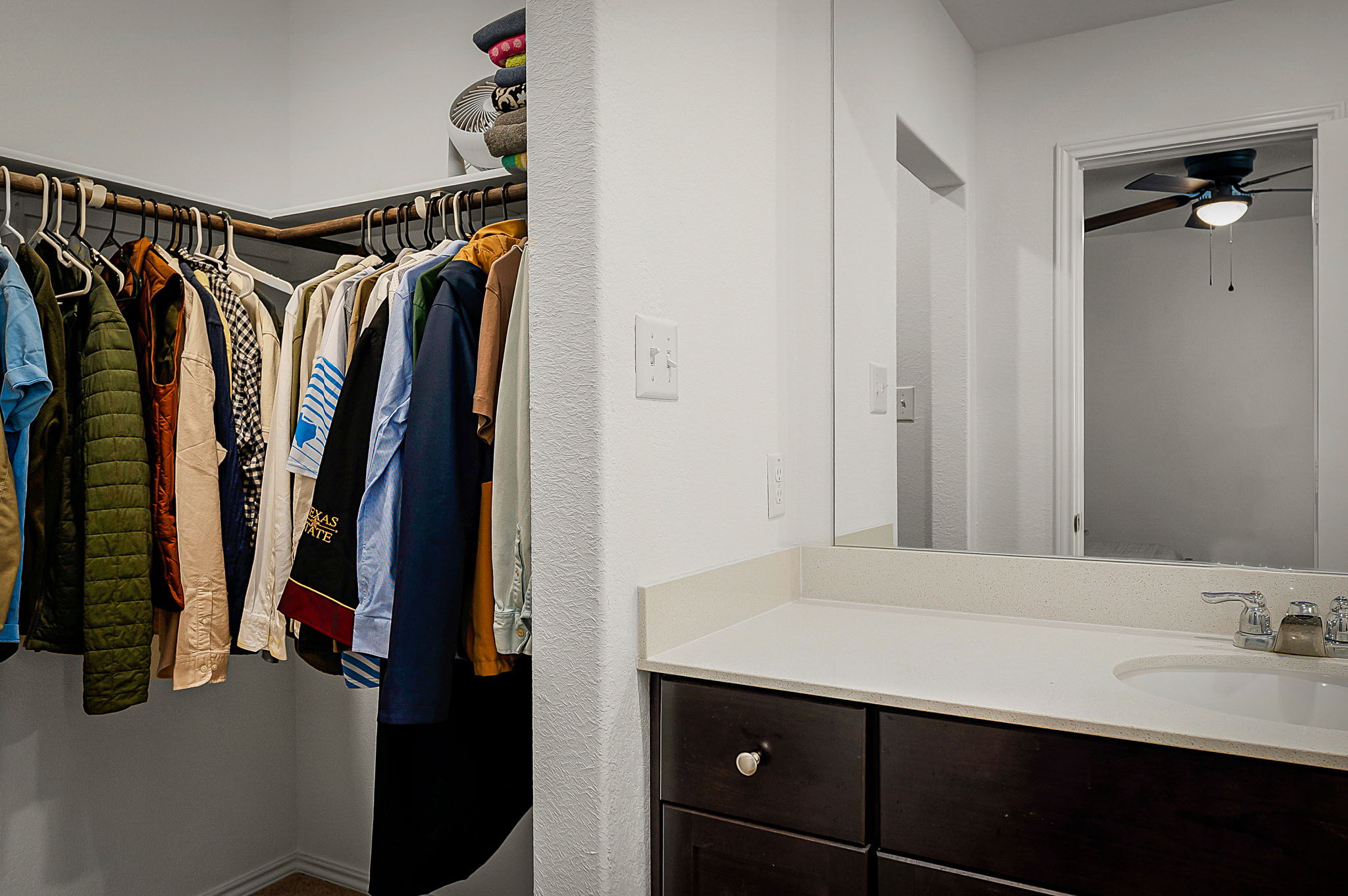 175 Amber Glen Maxwell, TX 78656 - Photo 26 of 27 a view of walk in closet with clothes and shoes