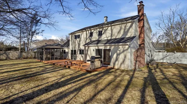 a view of a house with a large window and wooden floor