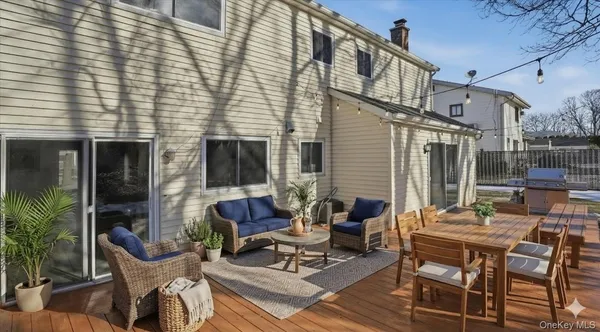 a backyard of a house with outdoor seating