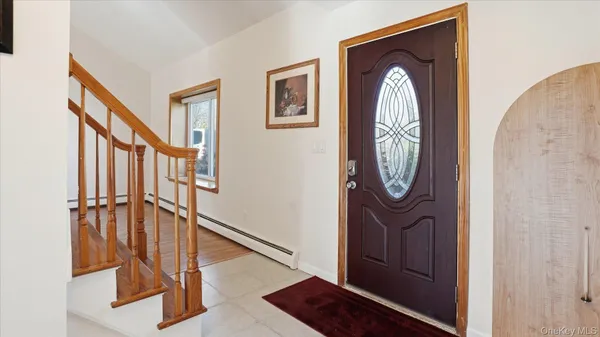 a view of staircase with wooden floor and a potted plant