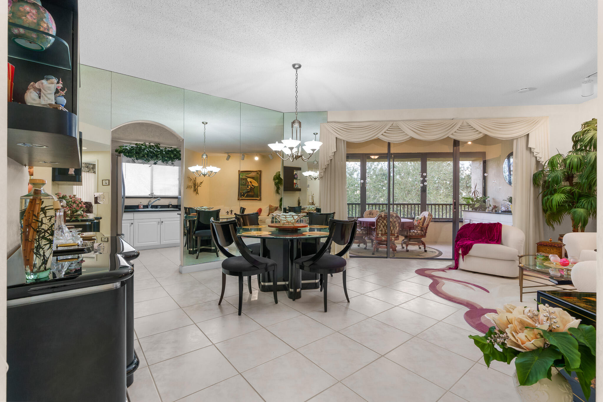 7546 La Paz Boulevard, Unit 405 Boca Raton, FL 33433 - Photo 2 of 43 a view of a dining room with furniture window and outside view