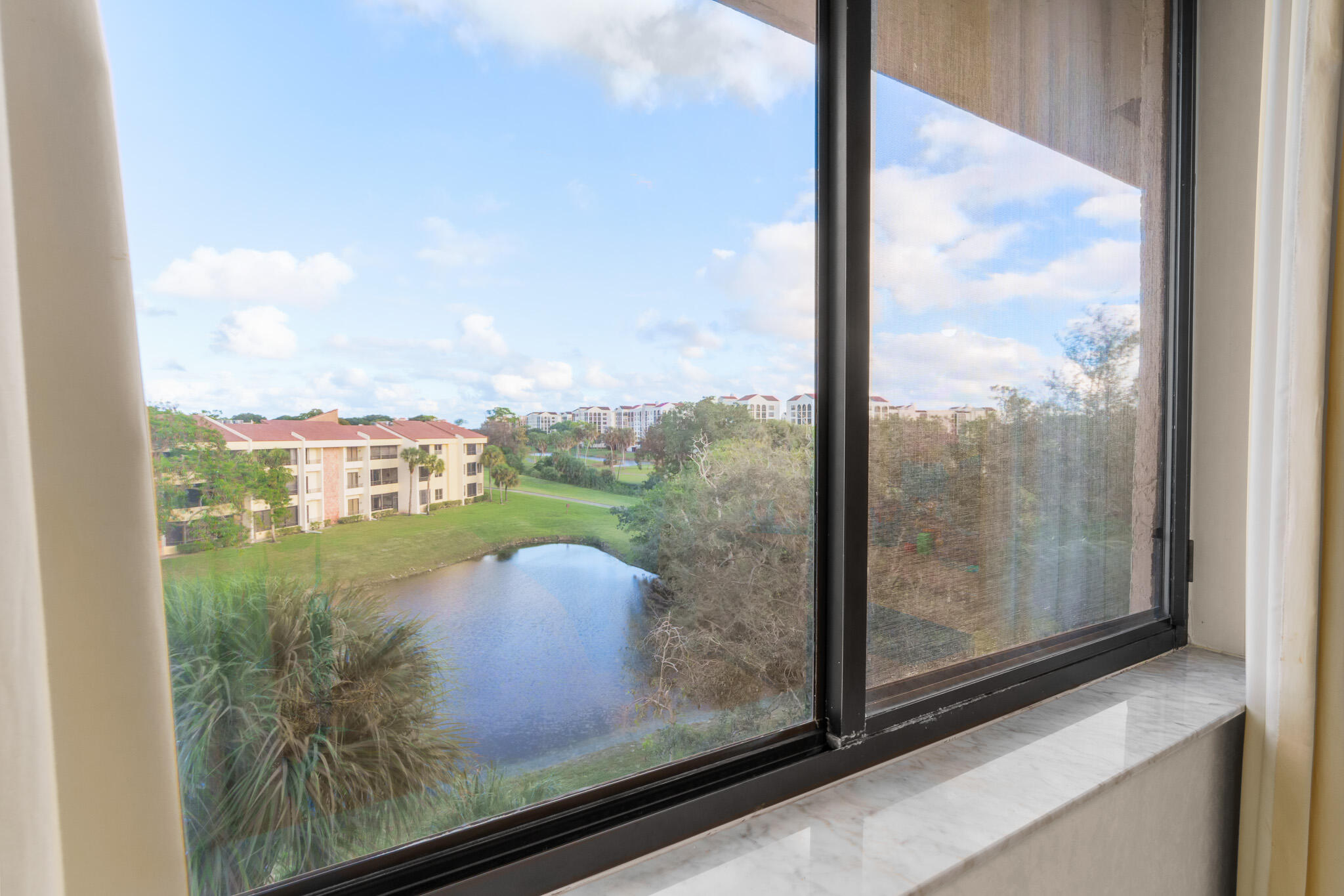 7546 La Paz Boulevard, Unit 405 Boca Raton, FL 33433 - Photo 23 of 43 a view from window