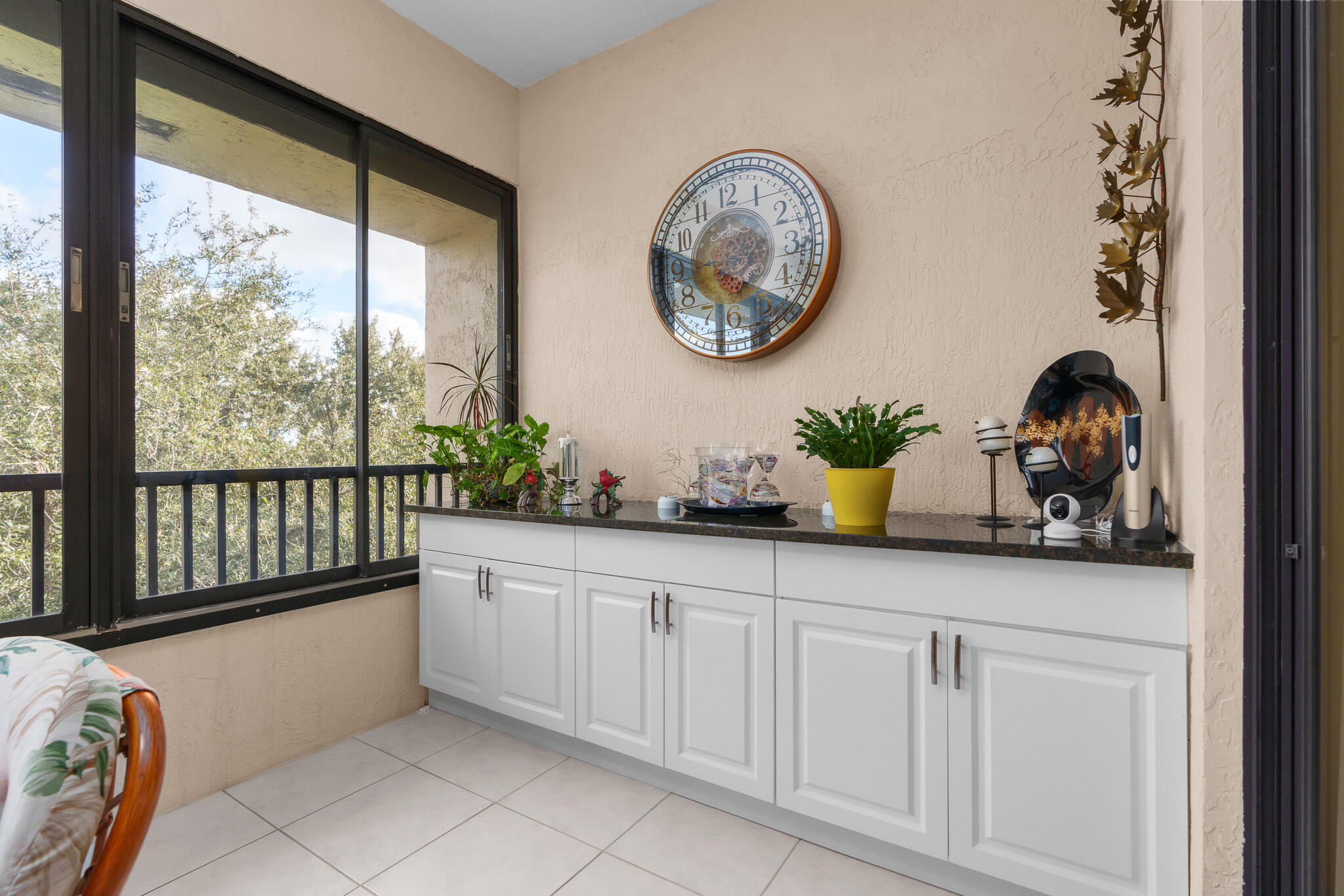 7546 La Paz Boulevard, Unit 405 Boca Raton, FL 33433 - Photo 31 of 43 a bathroom with a two sinks a large mirror and a large window