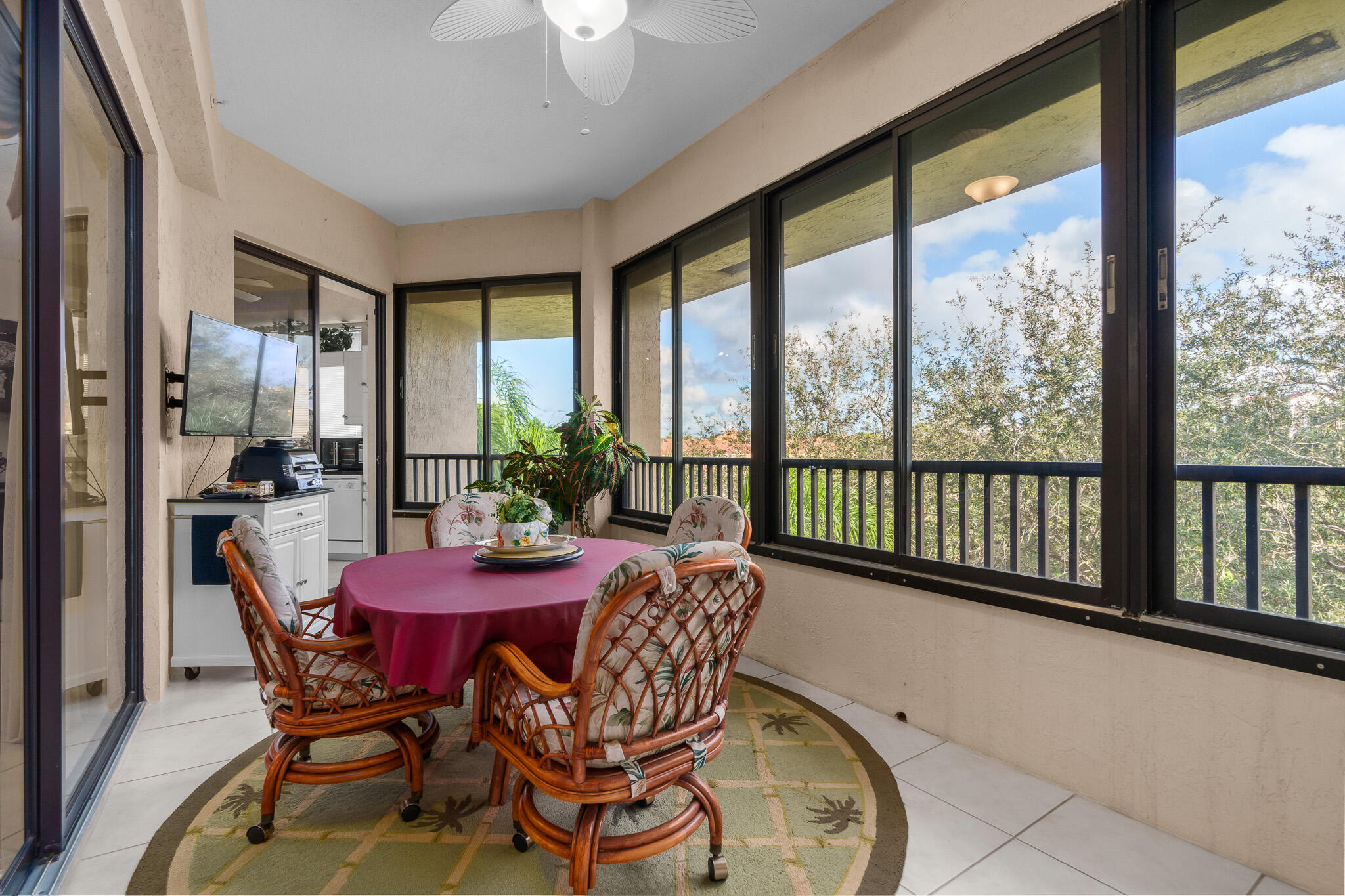 7546 La Paz Boulevard, Unit 405 Boca Raton, FL 33433 - Photo 32 of 43 a view of a dining room with furniture window and outside view