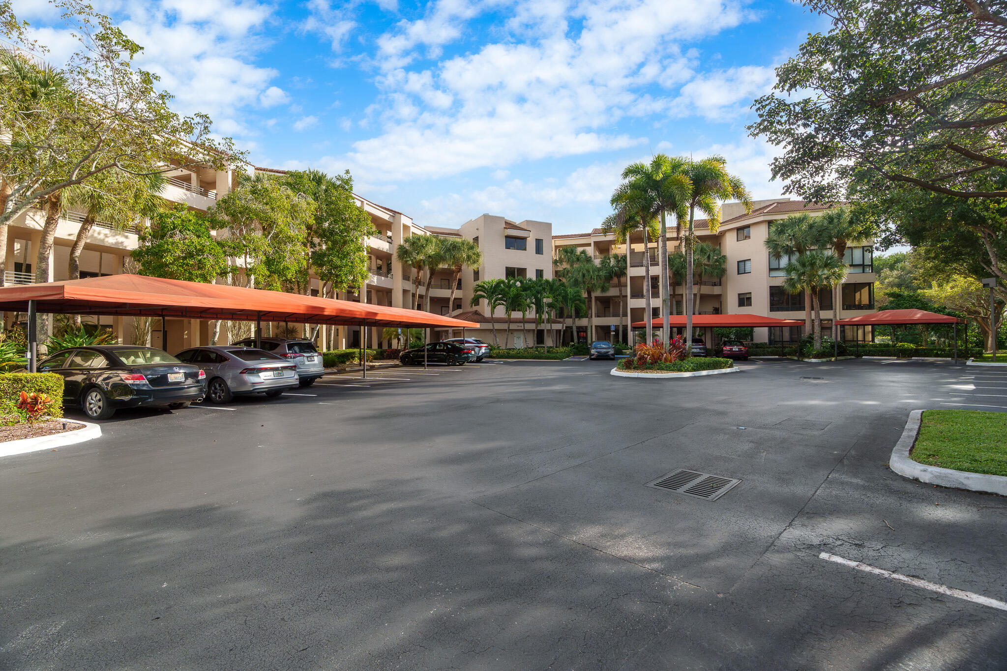 7546 La Paz Boulevard, Unit 405 Boca Raton, FL 33433 - Photo 40 of 43 a view of a street with cars