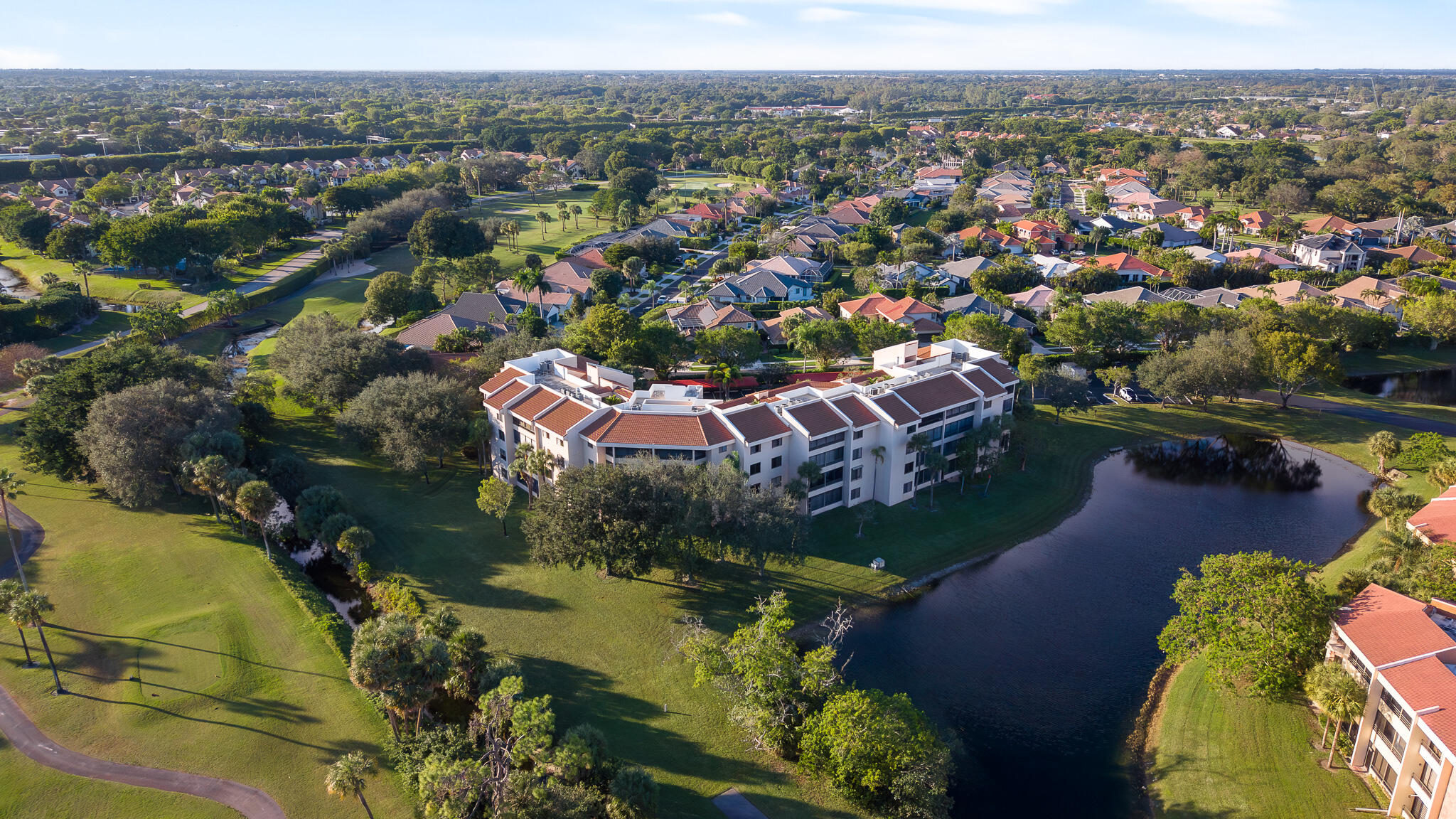 7546 La Paz Boulevard, Unit 405 Boca Raton, FL 33433 - Photo 42 of 43 an aerial view of residential houses with outdoor space