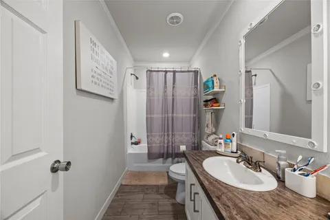 a spacious bathroom with a sink double vanity granite tub shower and mirror